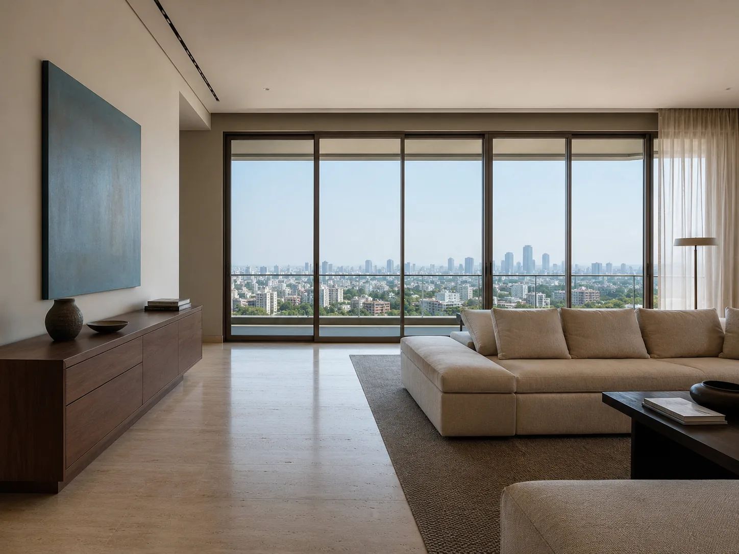 Living room of an apartment, city skyline beyond.