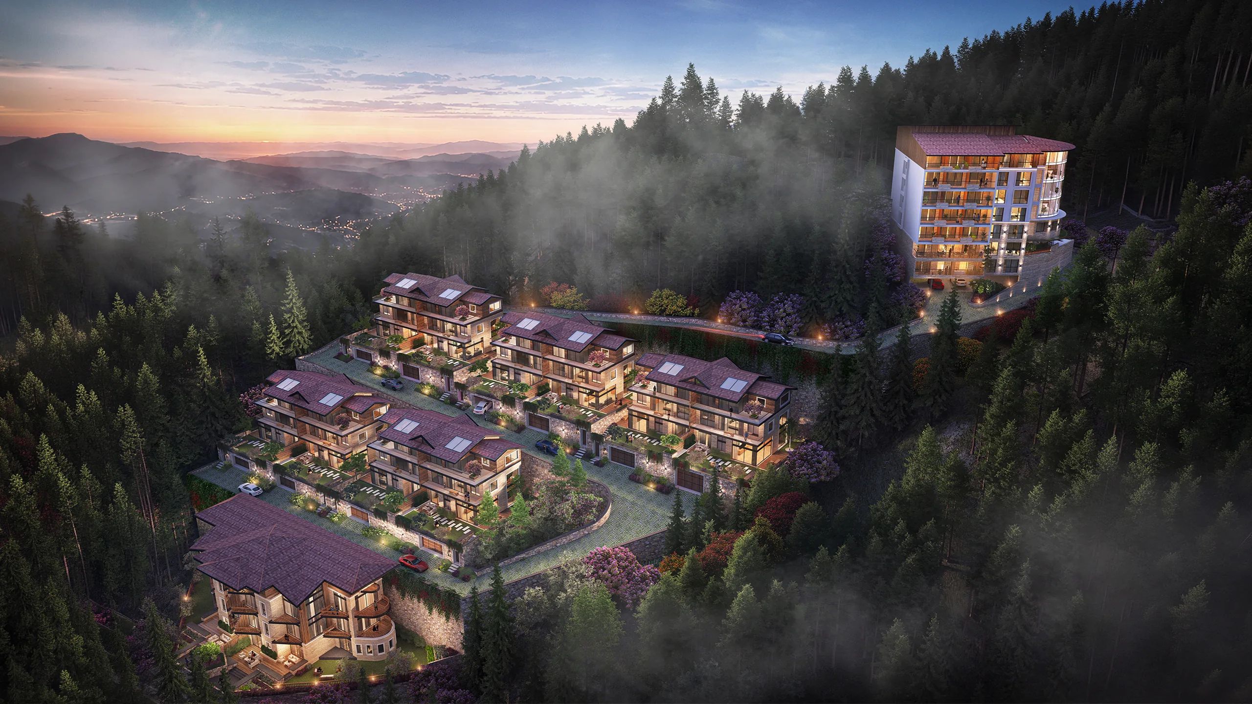Aerial view of the full site, the villas stepped down the contour.
